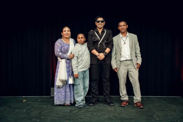 A family with Prakash Saput on stage